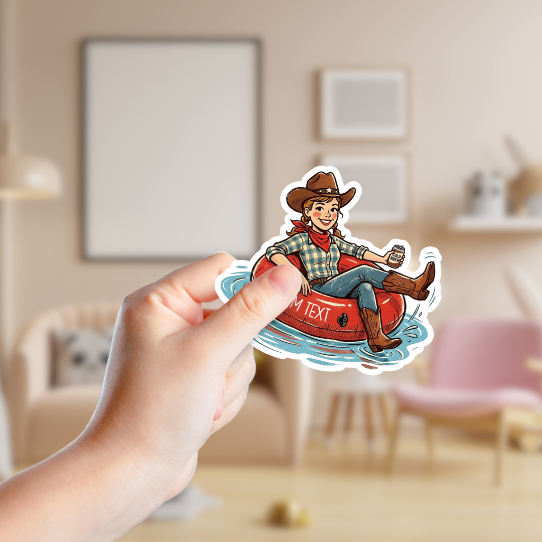 Hand holding a sticker of a person in a cowboy hat and plaid shirt with text overlay in a room.